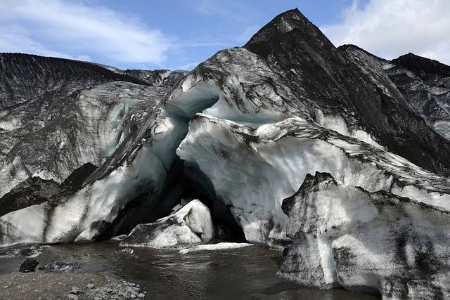 Glacier ice with dark carbon deposits